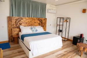 Postel nebo postele na pokoji v ubytování Kudhi Boli Beach House