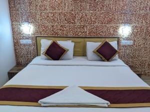 Ένα ή περισσότερα κρεβάτια σε δωμάτιο στο Hotel Feathers