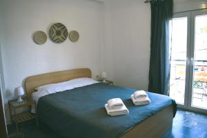 Postel nebo postele na pokoji v ubytování Boho Sea View Apartment