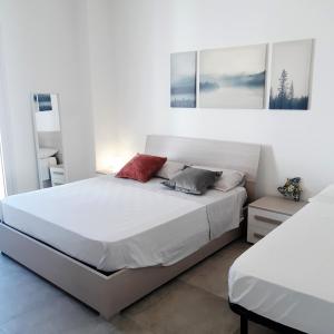 מיטה או מיטות בחדר ב-VILLETTA A 40 PASSI DAL MARE GALLIPOLI
