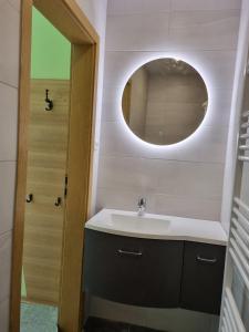 a bathroom with a sink and a mirror at Meeresbriese Warnemünde in Warnemünde +12 photos