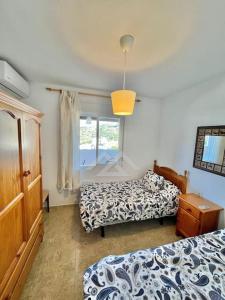 Łóżko lub łóżka w pokoju w obiekcie Dúplex ocean sea views