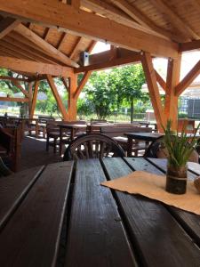 a wooden table with a napkin on top of it at Hotel-Restaurant zur Post in Wabern