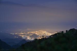 a view of a city lit up at night at Hotel Termales del Ruiz in Manizales