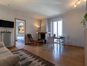 A television and/or entertainment centre at Mamma Ciccia Holiday Home - Sunset Balcony