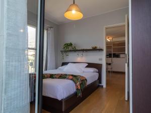 A bed or beds in a room at Mamma Ciccia Holiday Home - Sunset Balcony