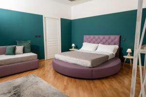 Postel nebo postele na pokoji v ubytování Villa Rufo