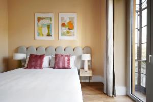 Posteľ alebo postele v izbe v ubytovaní Numa Seville Prestigio