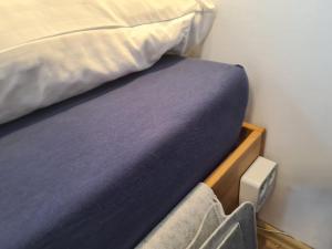 a bed with a pillow on top of it at Lichtdurchflutetes Zimmer - Marienberg in Waldbüttelbrunn