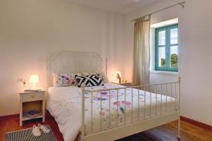Ein Bett oder Betten in einem Zimmer der Unterkunft Villa Lucia