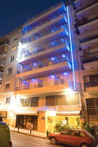 a building with a car parked in front of it at Socrates Hotel in Athens