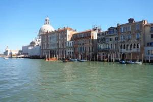a river with buildings and boats in the water at San Marco charming apartment with canal view in Venice