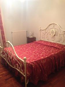Ένα ή περισσότερα κρεβάτια σε δωμάτιο στο La Margherita