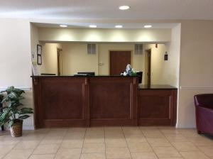 a waiting room with a reception desk in a hospital at Days Inn by Wyndham Greensboro NC in Greensboro