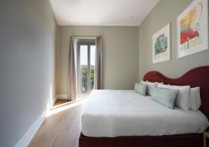 Posteľ alebo postele v izbe v ubytovaní Numa Seville Prestigio