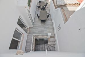 an overhead view of the living room of a house with a fireplace at New Village Guest House in Lagos