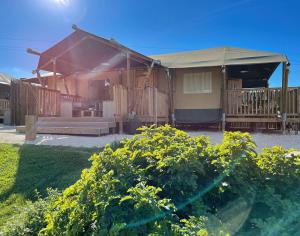 a house with a gazebo and a porch at Kuanza Farmhouse and Lodge in Zambujeira do Mar
