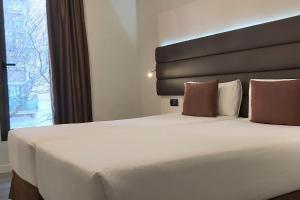 Postel nebo postele na pokoji v ubytování BCN Urbaness Hotels Del Comte