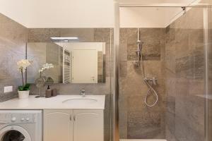 a bathroom with a sink and a shower at Bellavista Apartments - By Impero House in Levo +48 photos