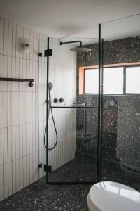 a bathroom with a shower and a toilet at Beautiful Bohemia apt in Jaffa in Tel Aviv