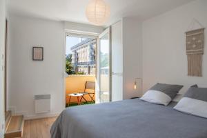 Posteľ alebo postele v izbe v ubytovaní Appartement Élégant à 2 Pas de la Mer