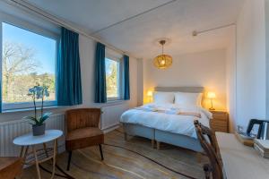 Ένα ή περισσότερα κρεβάτια σε δωμάτιο στο Geulzicht Hotel