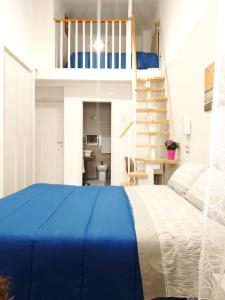 a bedroom with a bunk bed and a staircase at Casa Al Massimo in Palermo