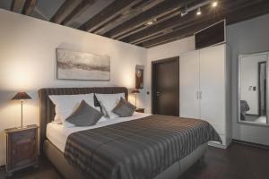 a bedroom with a large bed with pillows at WK - Suite in Dülmen