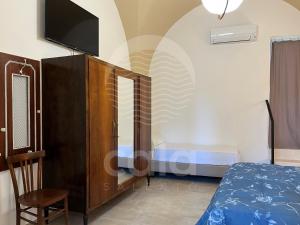 En eller flere senge i et værelse på Le Volte - Santa Maria al Bagno By Cala Salento