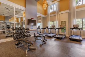 a gym with a lot of treadmills and ellipticals at Lovely Doral 2BR Pool Gym MIA-16 in Miami