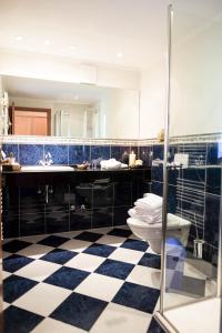 a bathroom with a toilet and a sink at Hotel Molitors Mühle in Eisenschmitt