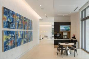 a living room with a large painting on the wall at Coral Gables 1br w wd pool gym near shops MIA-53 in Miami