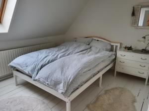 Ένα ή περισσότερα κρεβάτια σε δωμάτιο στο Urlaub im Haus an der Bucht