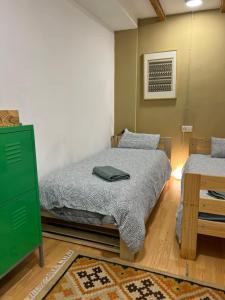 Tempat tidur dalam kamar di Precioso apartamento en el centro de Esparreguera