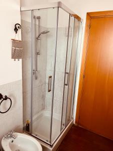 a shower in a bathroom with a toilet and a sink at Faro exclusive suite in Bari