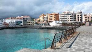 a group of buildings next to a body of water at Casa Ecuador in Güimar