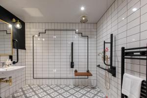 a bathroom with a shower and a sink at Hort's Townhouse in Bristol