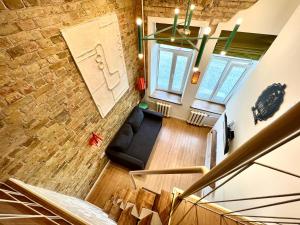 an overhead view of a living room with a brick wall at Kyiv Whisky Box Apart-Hotel in Kyiv
