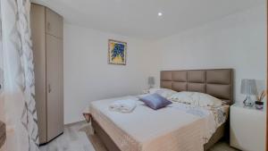 Ένα ή περισσότερα κρεβάτια σε δωμάτιο στο Casa Ivana +39 φωτογραφίες