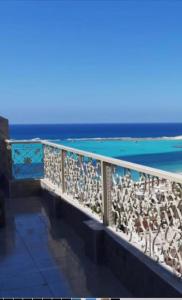a view of the ocean from the balcony of a building at زهرة مطروح للشقق الفندقية in Marsa Matruh