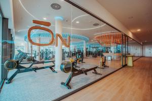 a gym with gym equipment in a building at Higueron Rental Playa Mira in Benalmádena