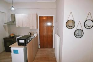 A kitchen or kitchenette at Cozy Apartment in the heart of Athens!