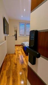 an empty room with a phone on a wall at Private Room in Modern Apartment in Aberdeen