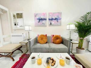a living room with a couch and a table at Juderia de Sevilla VI Luxury Apartments in Seville