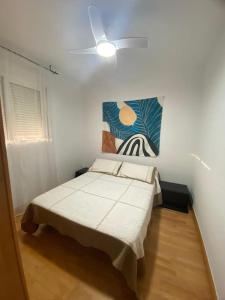 Cama o camas de una habitación en Apartamento moderno con piscina en Almería capital