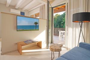 a living room with a view of the ocean at Lamasu RioVerde - Lago di Garda in San Felice del Benaco