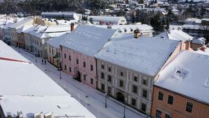 an aerial view of a city with snow covered buildings at Franco Apartments in Kežmarok