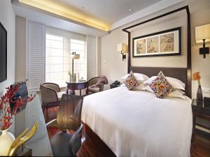 Postel nebo postele na pokoji v ubytování SSAW Boutique Hotel Shanghai Hongkou