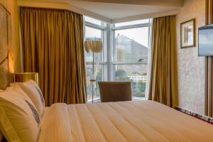 Giường trong phòng chung tại Melissa Hotel +63 ảnh