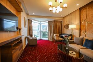 a living room with a couch and a table at Melissa Hotel in Oran